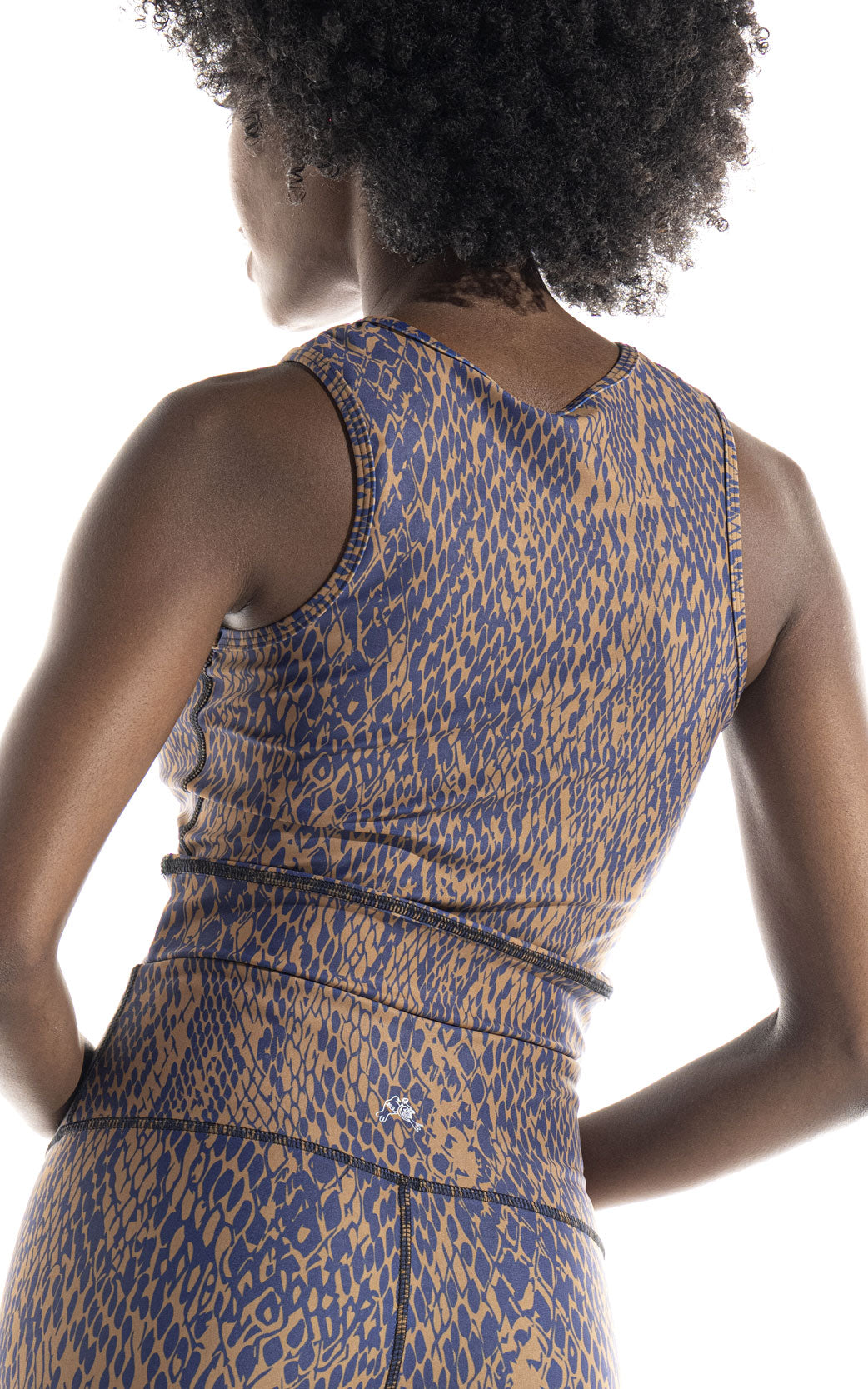 Women's active set in printed skin print. Trending colors Navy and Gold make this a fashion forward sophisticated set to wear for yoga, pilates, running, spinning or any activity. Full length legging has a 26" Inseam and tank is slightly cropped and fitted. Super comfortable