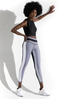 Women's mid rise track legging has an inside and an outsdie track. Printed Black back and Grey front with white tracks and the legging has a 26" Inseam. Also comes in Capri with a 22" Inseam